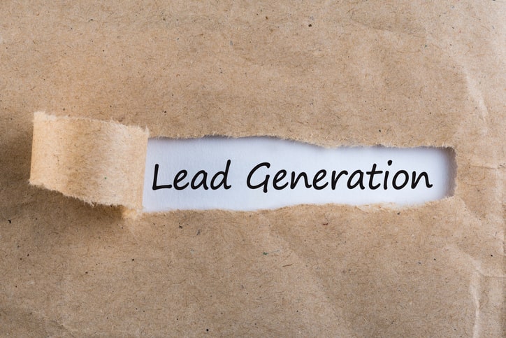 Torn piece of brown paper revealing the text "Lead Generation" written on white, hinting at expert advice from franchise consultants.